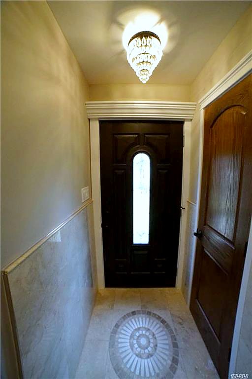 New entry with inlaid tile medallion