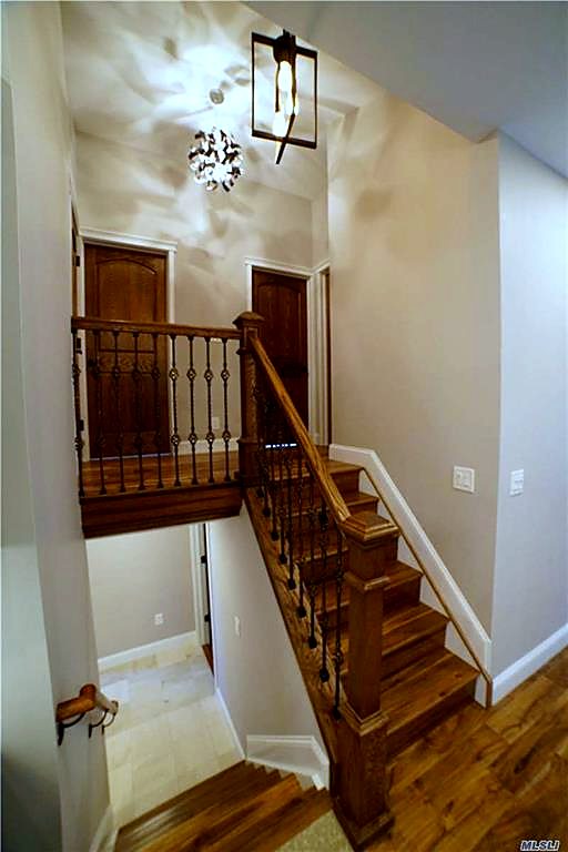 New oak stair with wrought-iron balusters